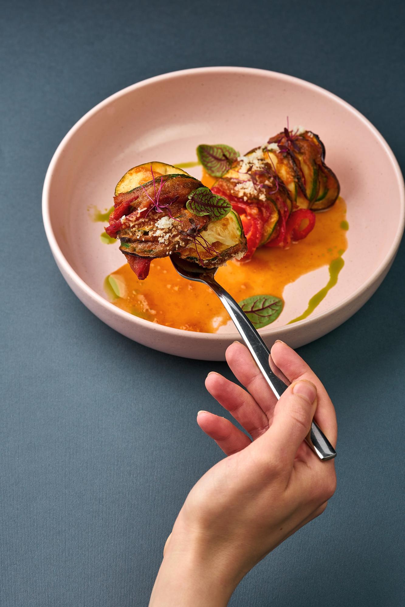hands plating a colorful weeknight meal
